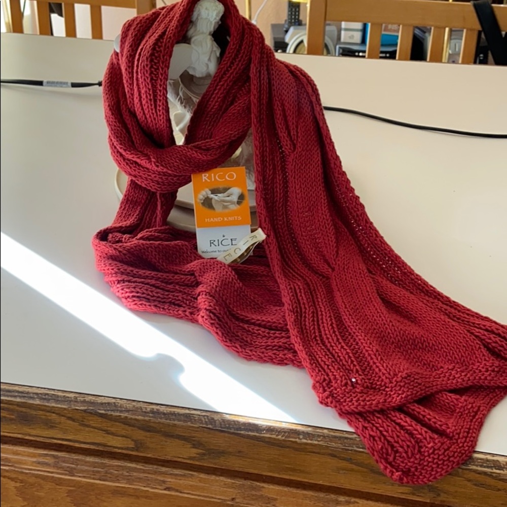 Rico hand knitted scarf with story tag